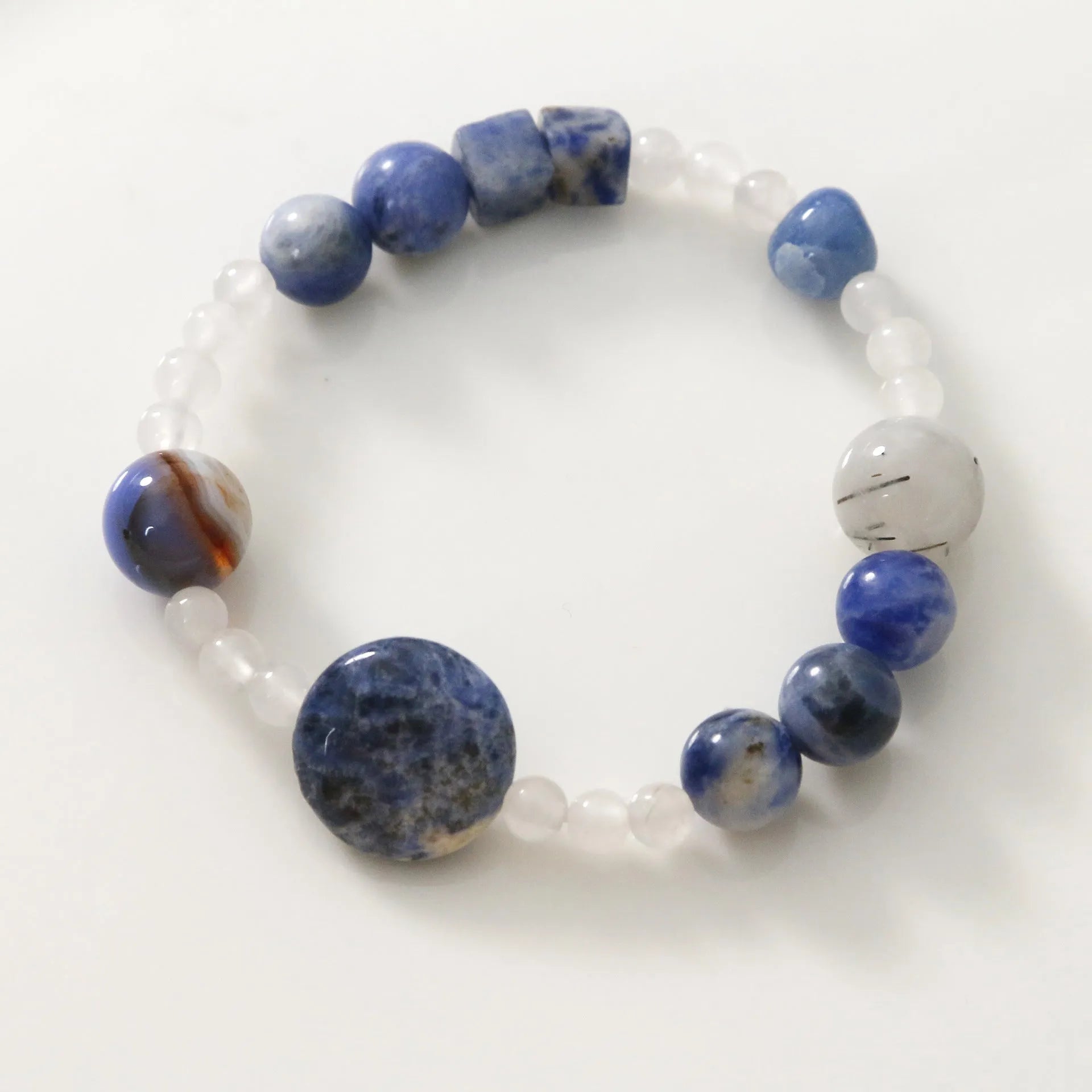 Natural blue point stone and black hair crystal agate hand-woven unisex bracelet with round and oval geometric beads