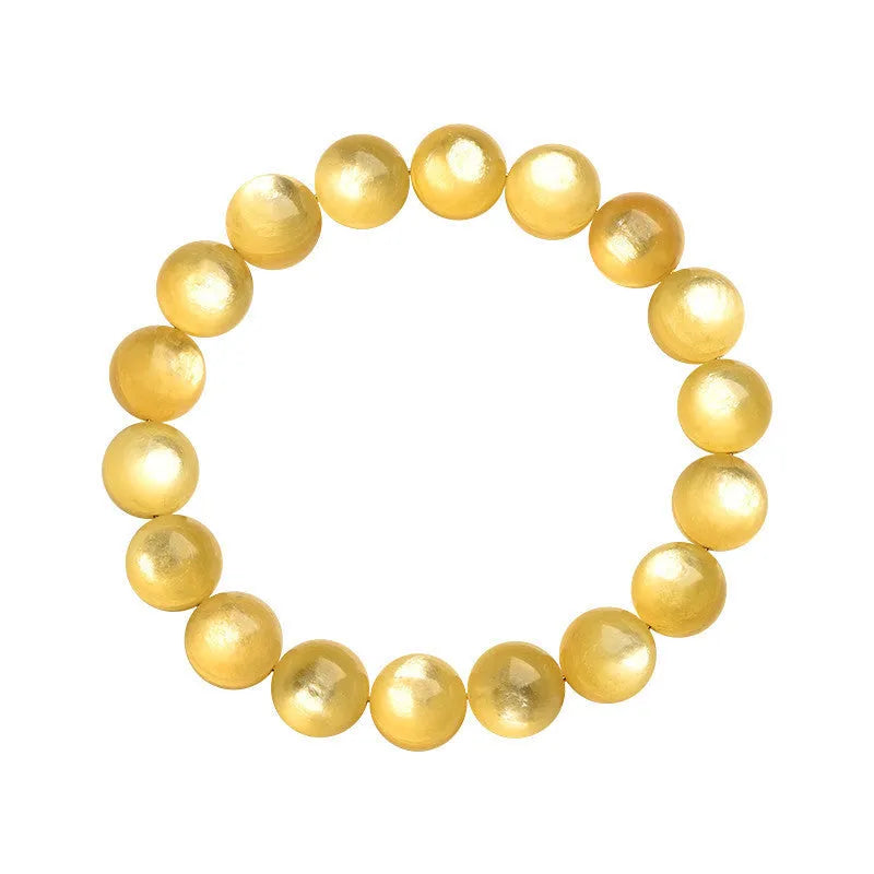 Polished natural mica round beads bracelet in yellow Lepidolite colour on flat surface