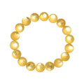 Polished natural mica round beads bracelet in yellow Lepidolite colour on flat surface