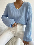 Women's solid colour long sleeve pullover in a loose casual fit, shown in one of five colour options.