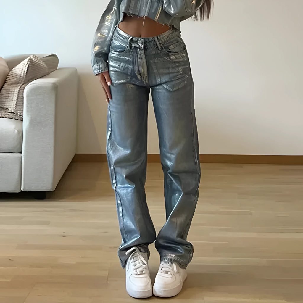 Women's high waist straight leg jeans in washed blue denim with hot silver contrast details