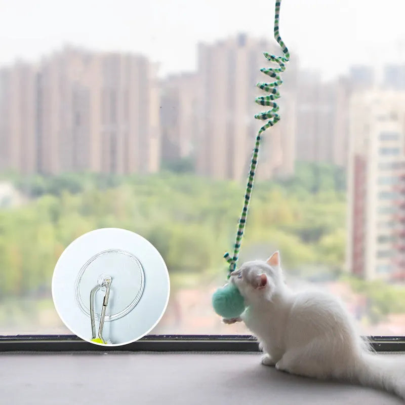 Kitten toy with hanging bell stick and inflatable ball attached by suction cup, available in blue, green, purple, red, or yellow
