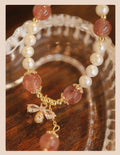 Crystal strawberry quartz bracelet with bow detail on white background, women's INS-style accessory