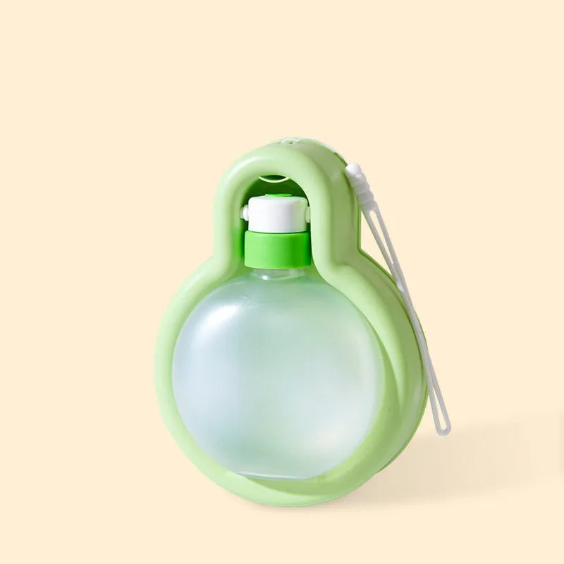 Green portable dog water bottle with pull-out drinking bowl, showing leak-proof design for travel.
