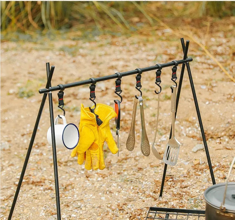 Large foldable aluminium camping drying rack with multiple hooks, set up outdoors.