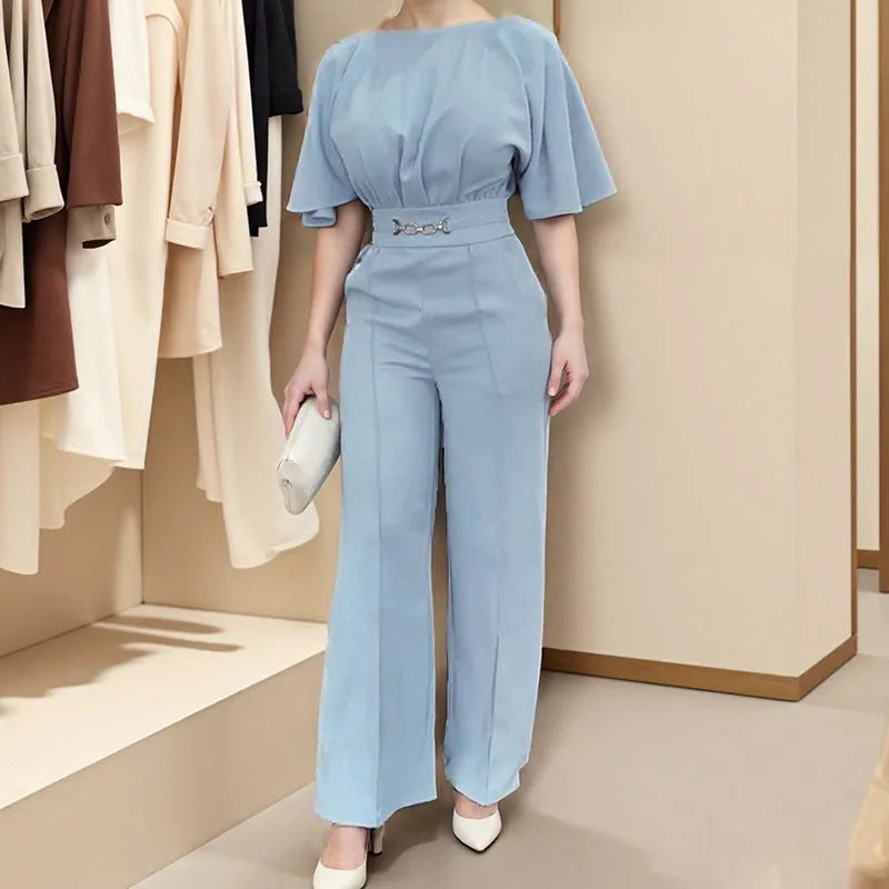 Blue polyester casual suit set with long sleeve top and trousers on a hanger