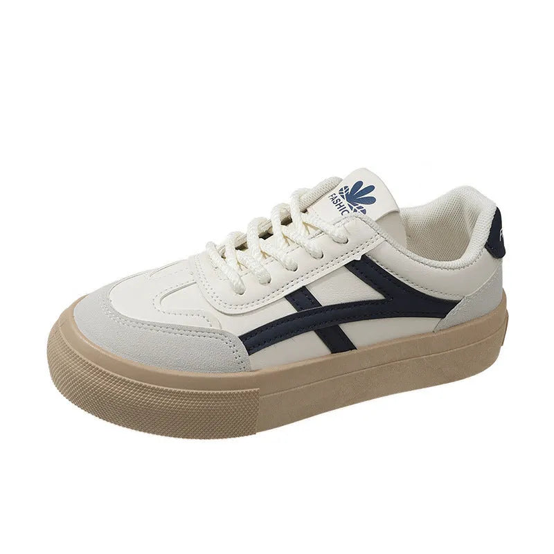 Blue and brown low-top women's borad shoes with patent leather upper and flat rubber sole.