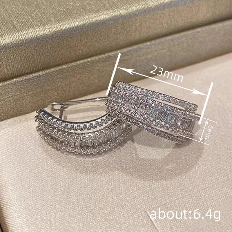 Women's white gold colour geometric stud earrings with zircon stones on copper base