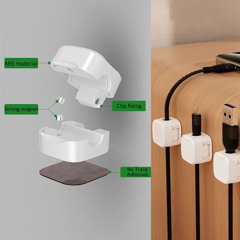 Magnetic cable clip in white holding a USB cable under a desk, with adhesive backing visible
