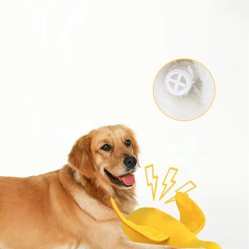 Yellow plush teddy duck dog toy with sound mechanism and treat leak hole for pet training