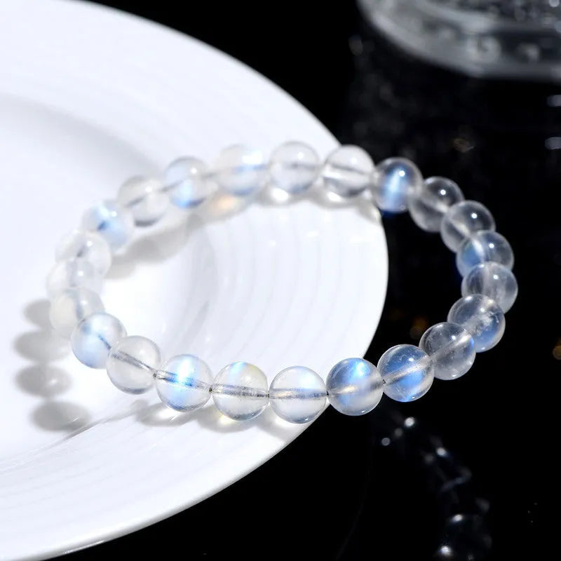 Natural cream body crystal blue moonlight bracelet showing polished finish on a simple band.