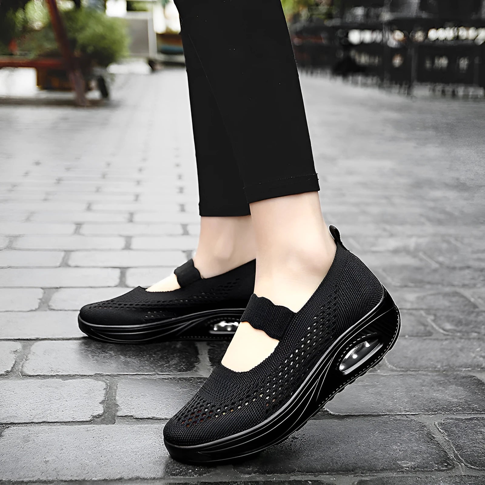 Women's slip-on mesh round toe casual shoes in black, side view