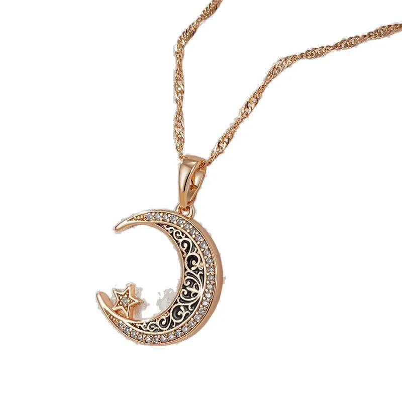 Rose gold star and moon necklace with zircon and enamel pendant on a water wave chain.