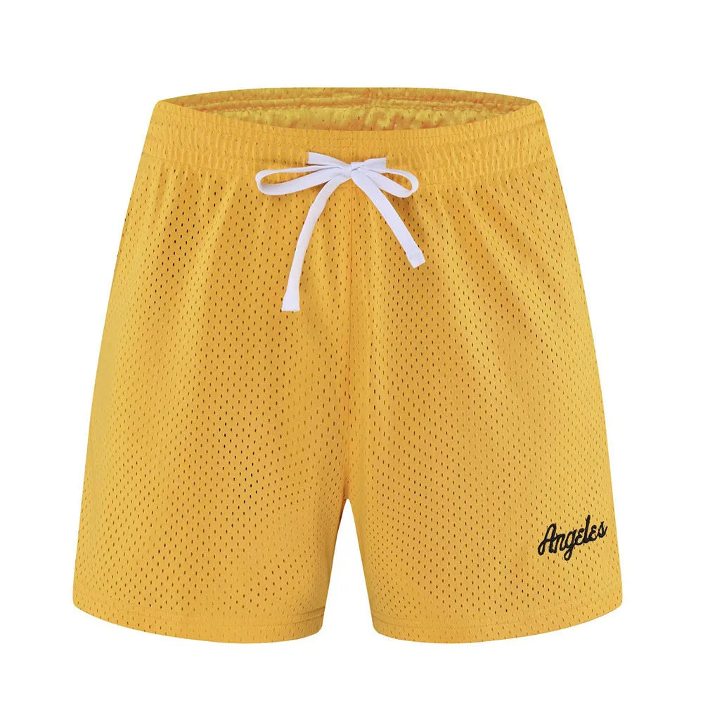 Men's black double-layer mesh sports shorts laid flat, showing waistband and loose fit.