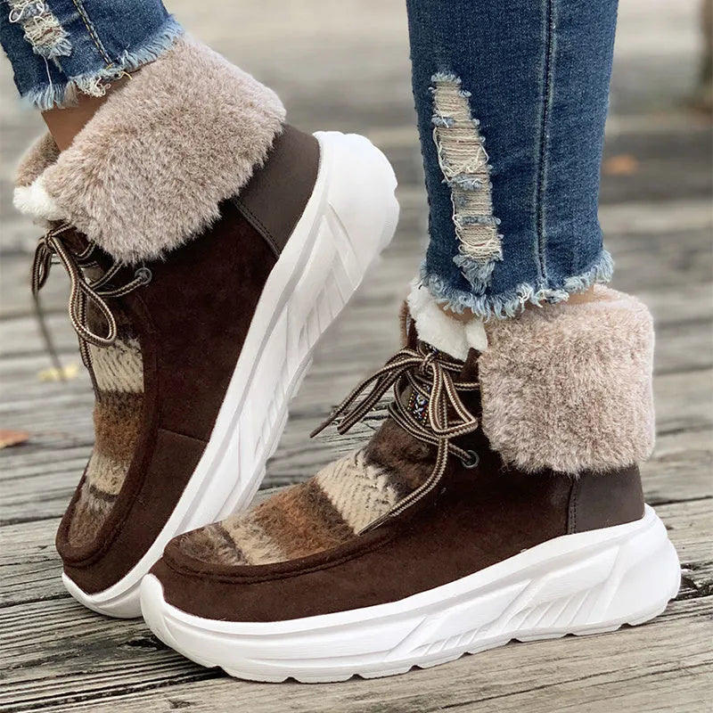 Women's beige suede lace-up snow boots with a thick rubber sole and plush lining on a white background.