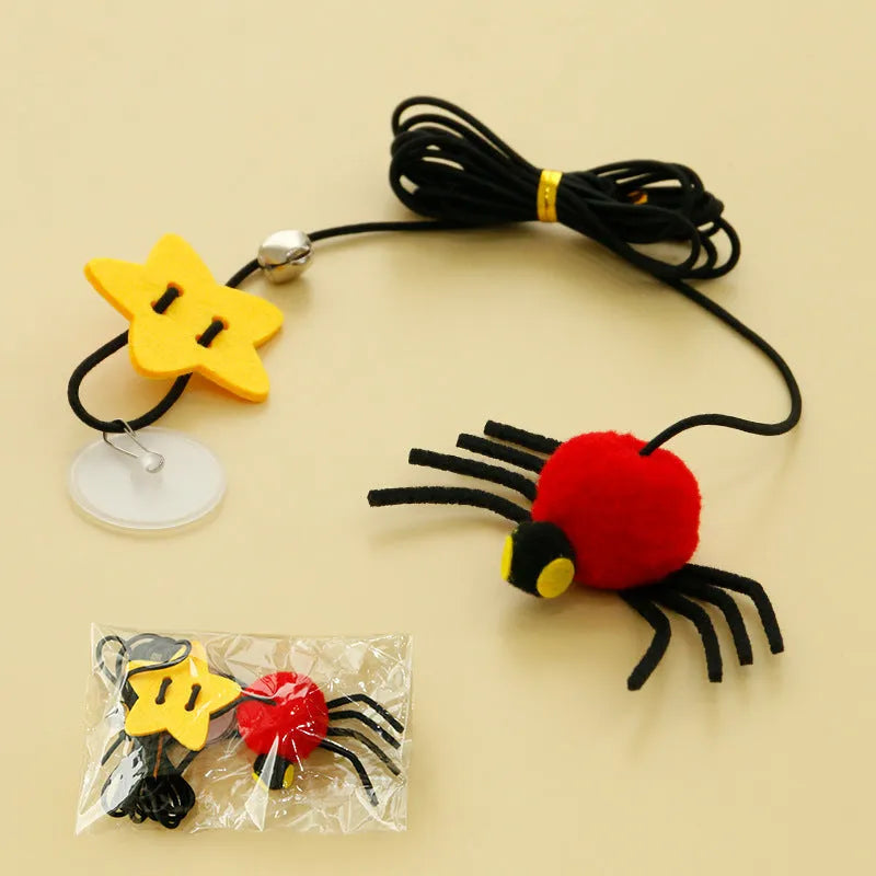 Red cat hanging toy with feather stick and bell spider on elastic rope mounted to door