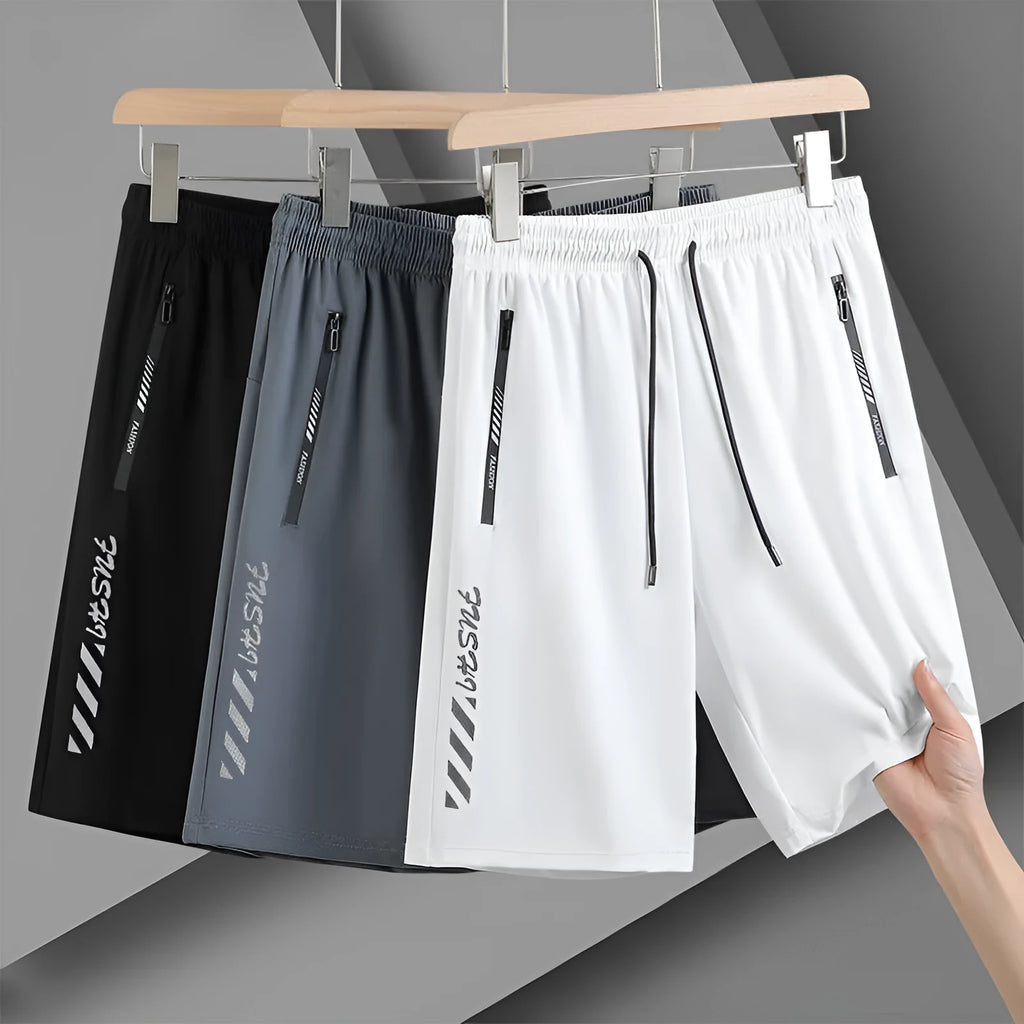 Men's black loose-fit quick-drying nylon sports shorts with a fifth pants length on a white background.