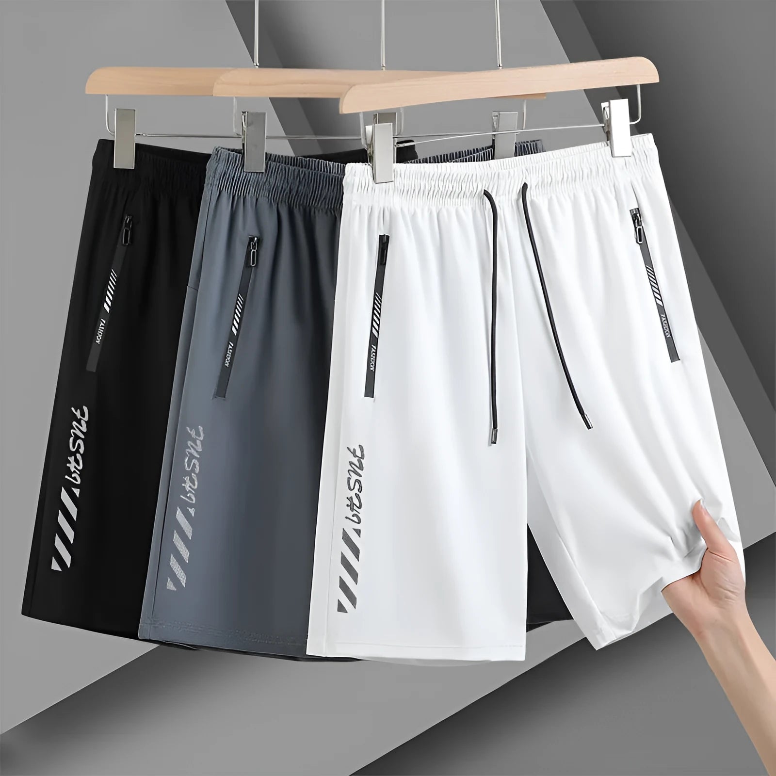 Men's black loose-fit quick-drying nylon sports shorts with a fifth pants length on a white background.