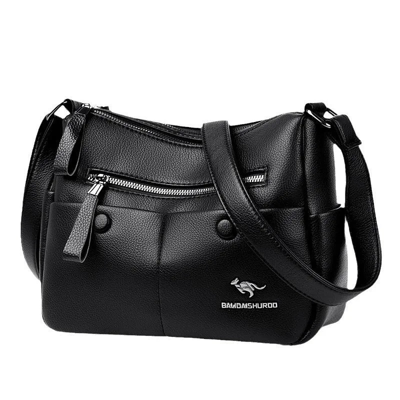 Soft PU leather crossbody bag in horizontal square shape with stitching detail, showing multiple colour options black dark blue wine red yellow.