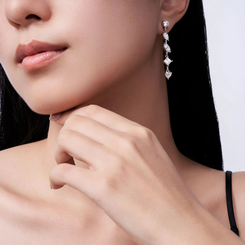 Pear-shaped moissanite drop earrings in 925 sterling silver with cold wind style on white background