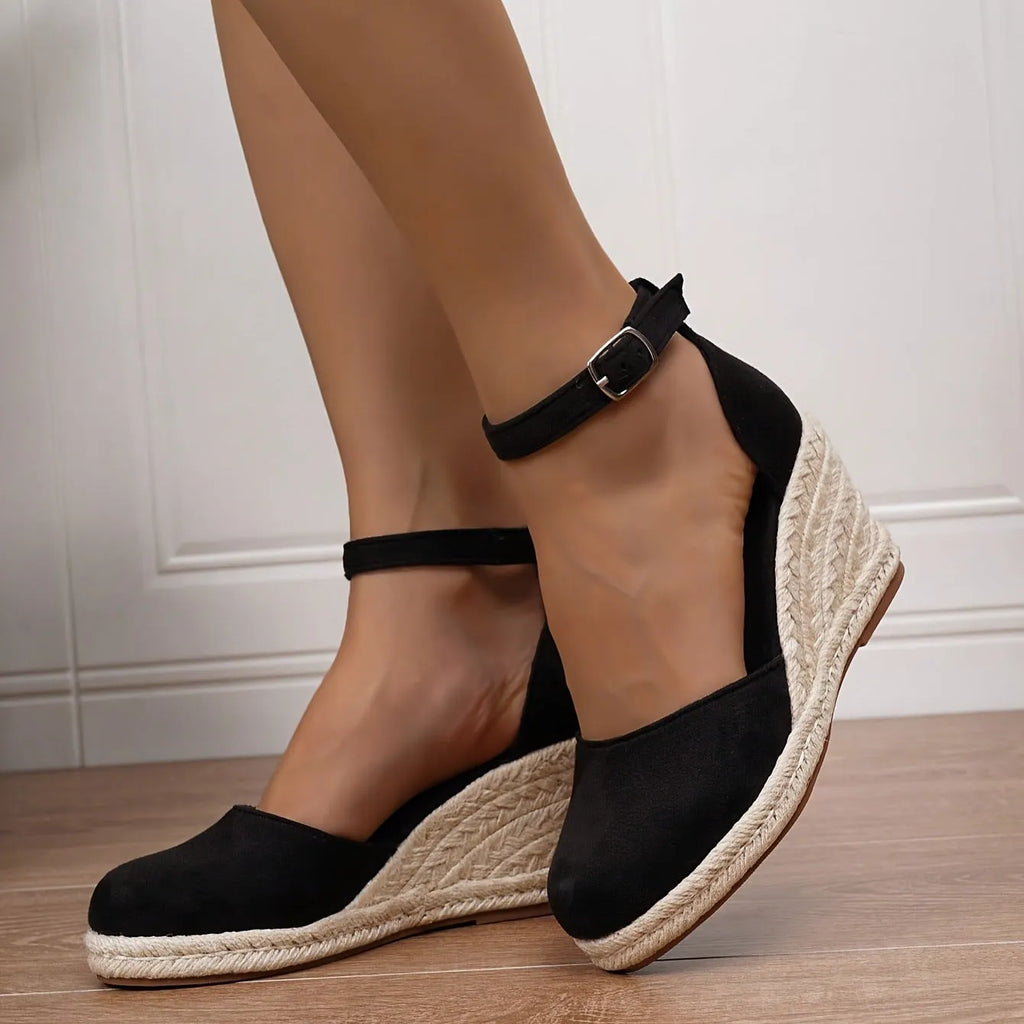 Women's apricot suede Roman style wedge sandals with buckle closure and rubber sole