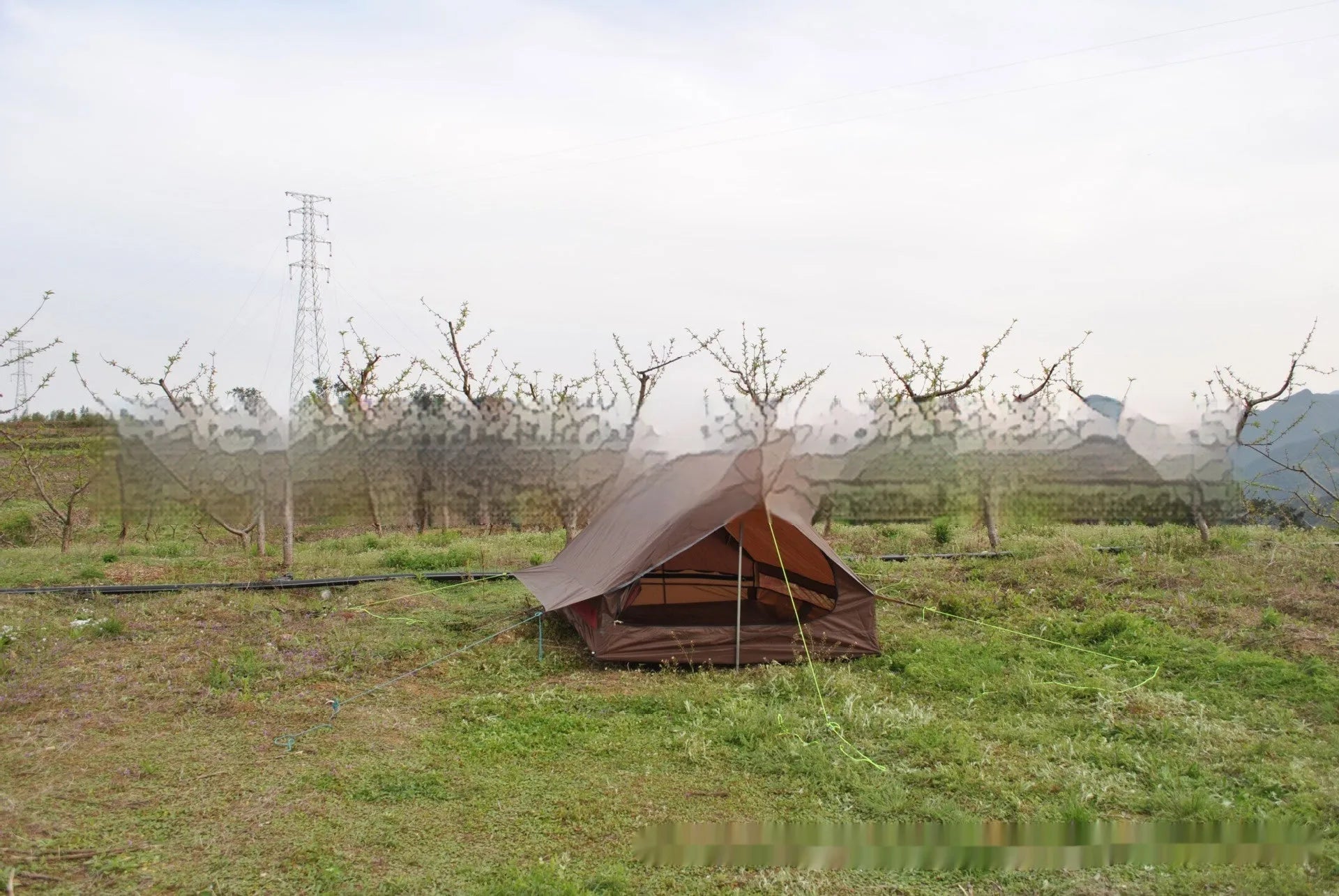 Brown or white A-line pole-free tent pitched with hiking canes showing 210x150x110cm dimensions