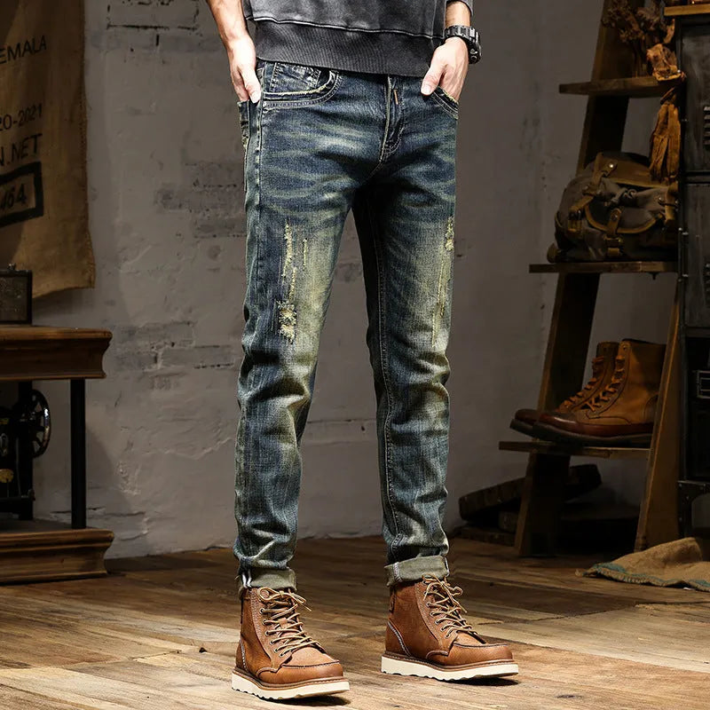 Men's skinny fit jeans in a retro blue denim wash with a zip fly closure.