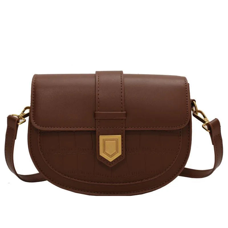 French one shoulder saddle bag in medium-soft PU with lock and stone pattern, available in black, brown, beige, and coffee