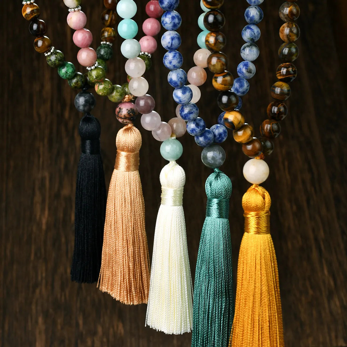Handmade Bohemian long necklace with natural stone tassel and geometric mixed gem pendant.