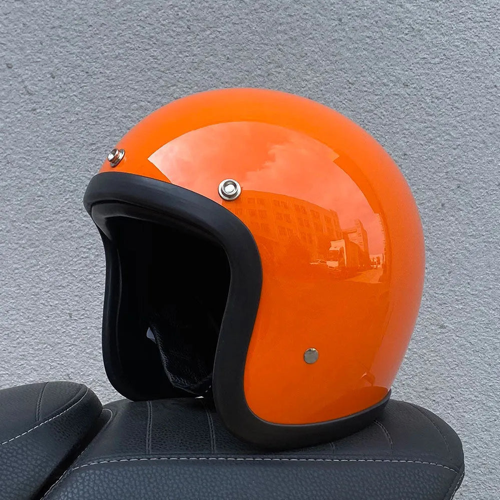 Glass fibre motorcycle half helmet in retro style shown in cement grey colour