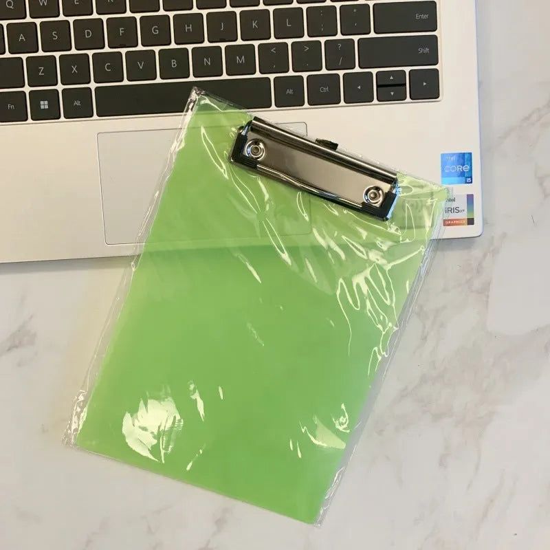 Transparent plastic A4 plate holder with metal clip and integrated writing board surface, shown in blue.