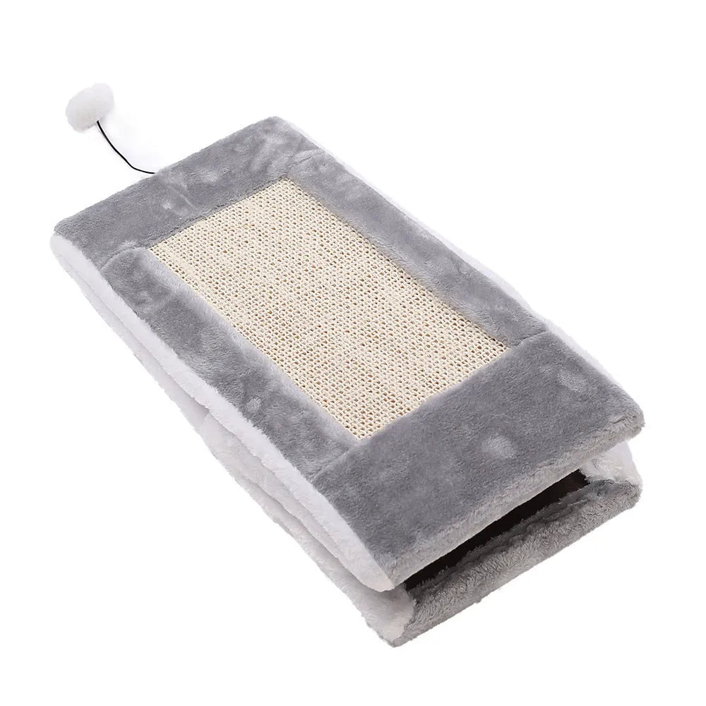 Triangular faux fur cat scratching post and bed platform in grey and white colours.