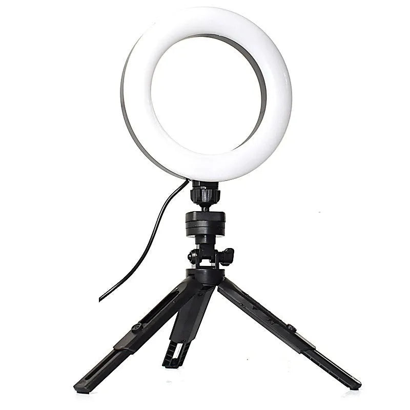 Black desktop fill light tripod suit holding a mobile phone for live streaming video.