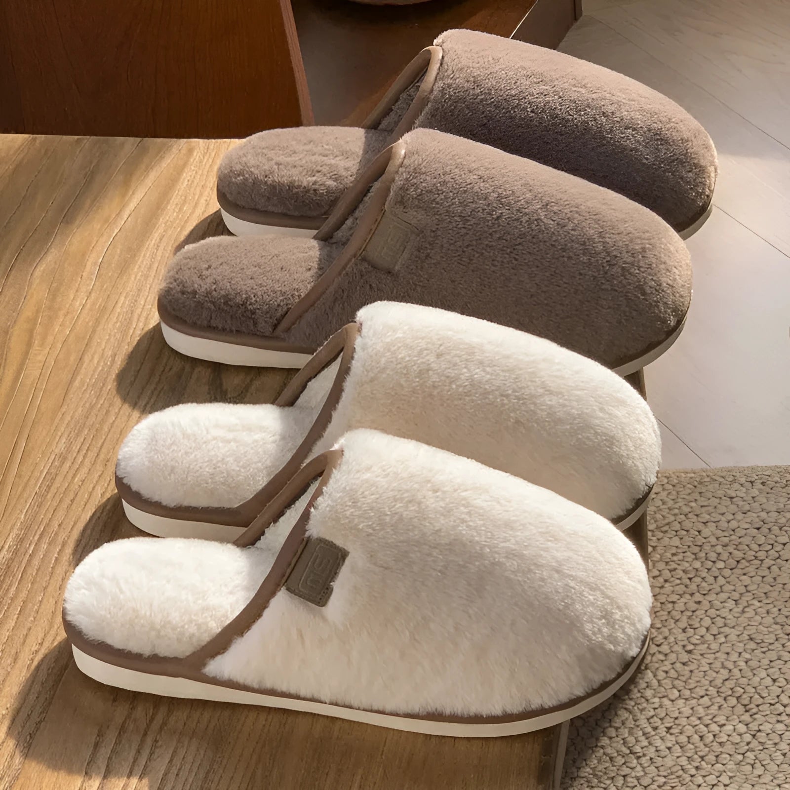 Solid colour winter plush slippers with non-slip PVC sole on a wooden floor.