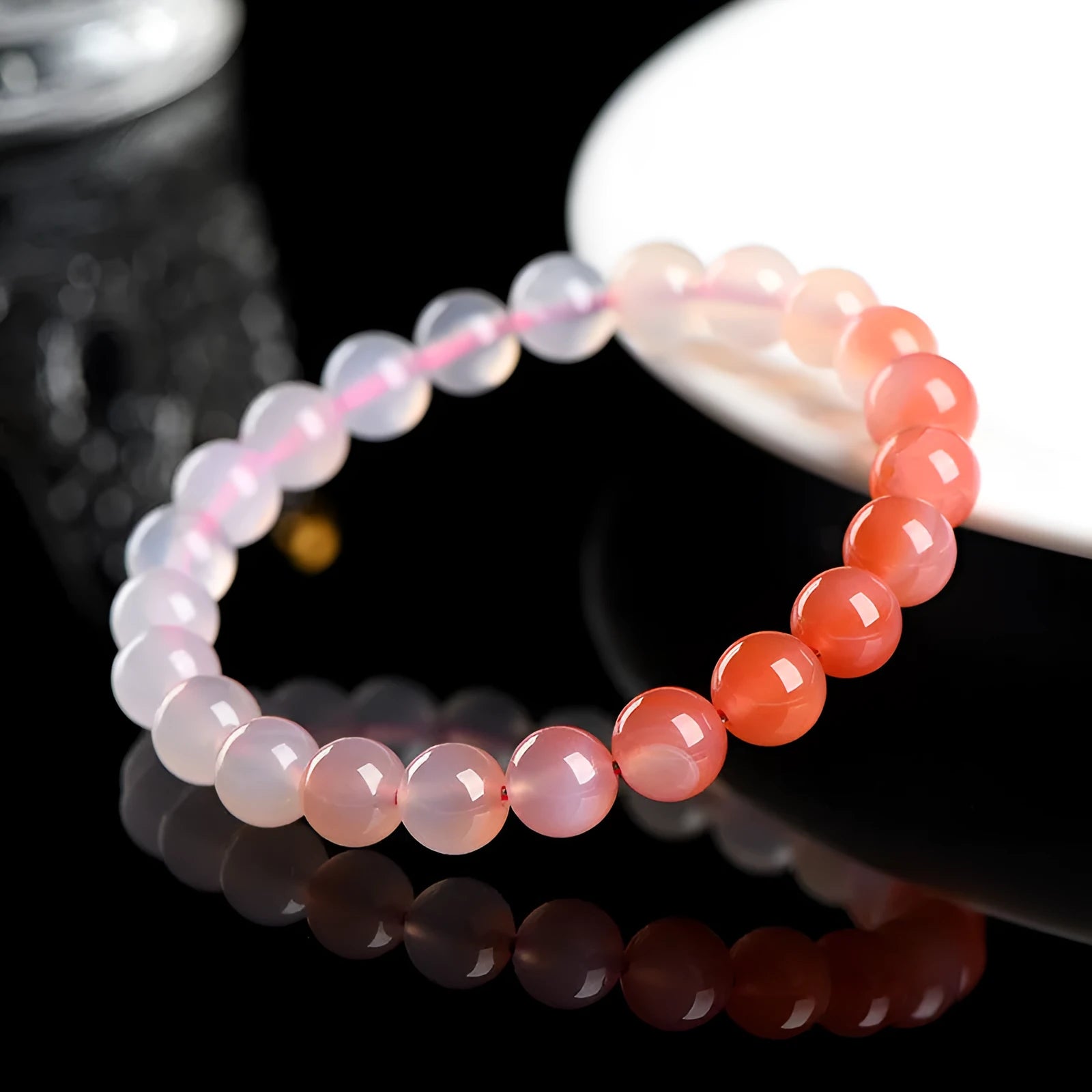Natural gradient Yanyuan agate bracelet with geometric beads in four size options.