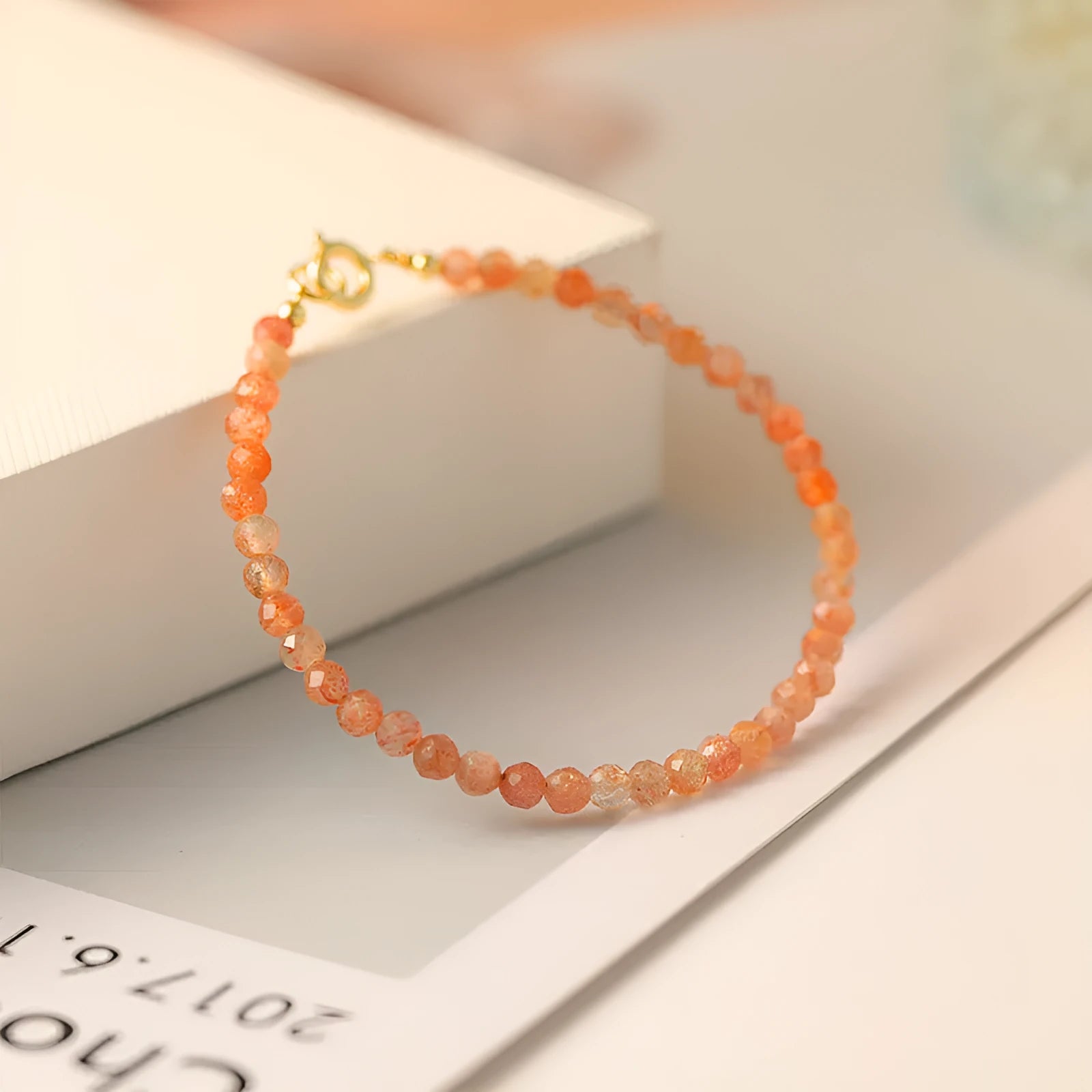 Natural sunstone crystal bracelet with ultra-thin 3mm beads on wrist, handmade women's accessory