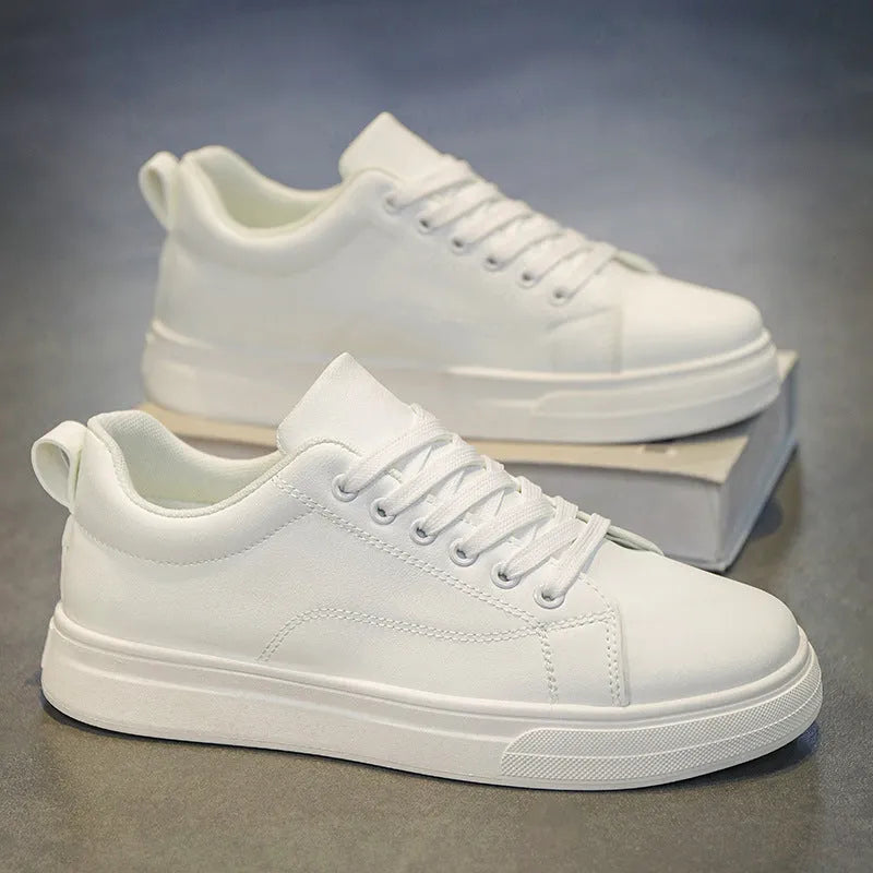 Men's low-top white and black Korean-style casual sneakers with a round toe and rubber sole.