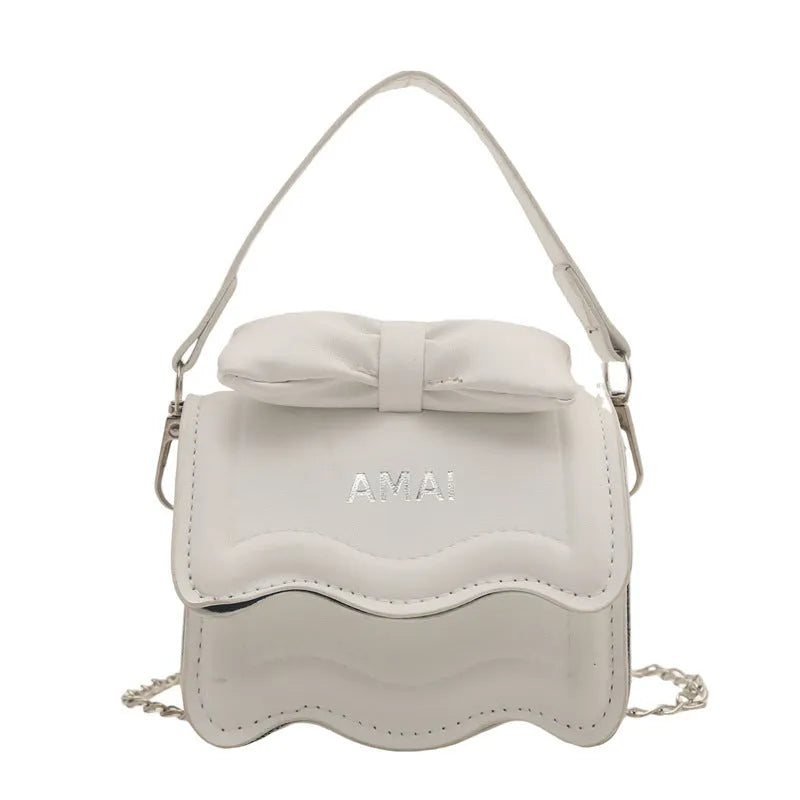 Mini crossbody bag in black, PU material, single shoulder strap, compact size for women