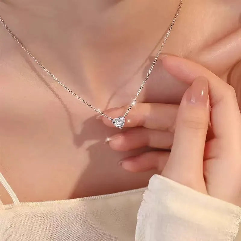Women's minimalist heart necklace in silver tone with copper construction