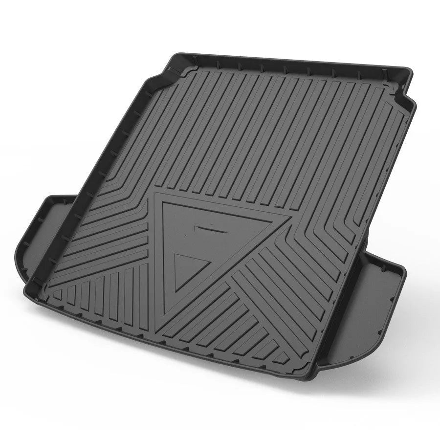 Black carbon fibre pattern TPE boot liner for a Special Car, showing textured surface and custom fit.