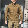Men's brown polyester tactics assassin jacket with plaid pattern on a hanger.