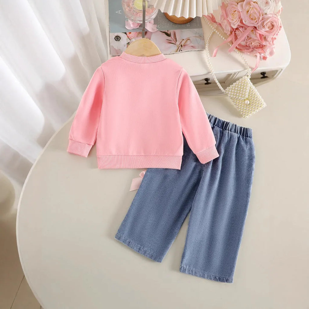 Pink two-piece baby girls outfit with long-sleeved sweater and trousers in cotton
