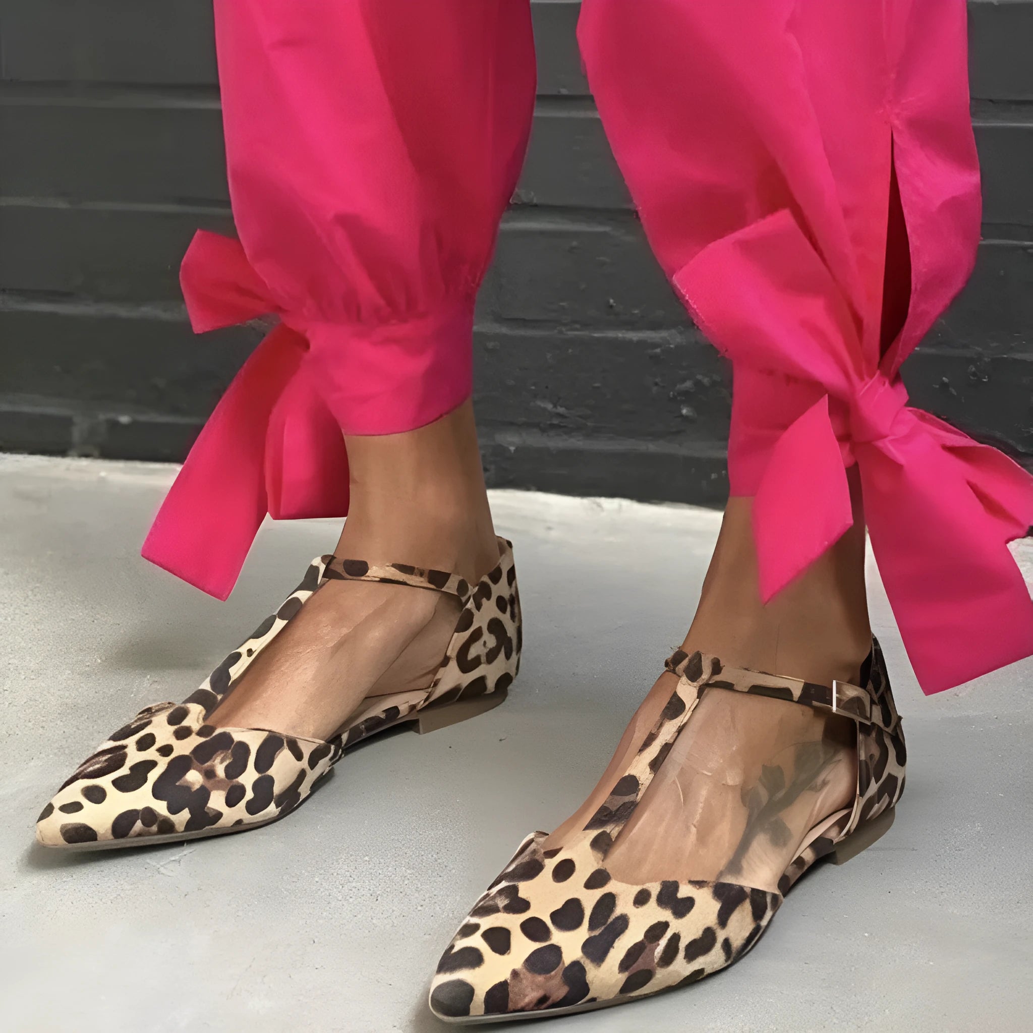 Women's leopard print pumps with pointed toe, chunky low heel, and cross shoulder straps