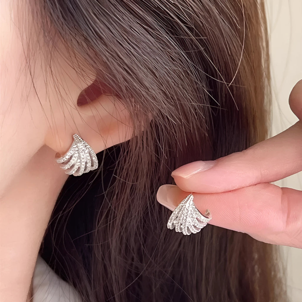 Platinum-coloured geometric line design earrings with zircon construction