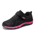 Women's grey purple low top wedge heel shoes with velcro strap and mesh upper.