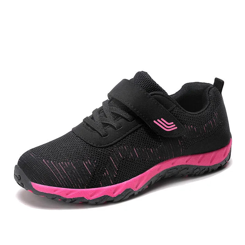 Women's grey purple low top wedge heel shoes with velcro strap and mesh upper.