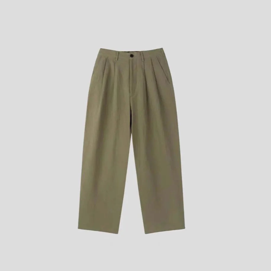 Men's loose fit cotton linen trousers in apricot, army green, and purplish blue, showing pencil leg opening.