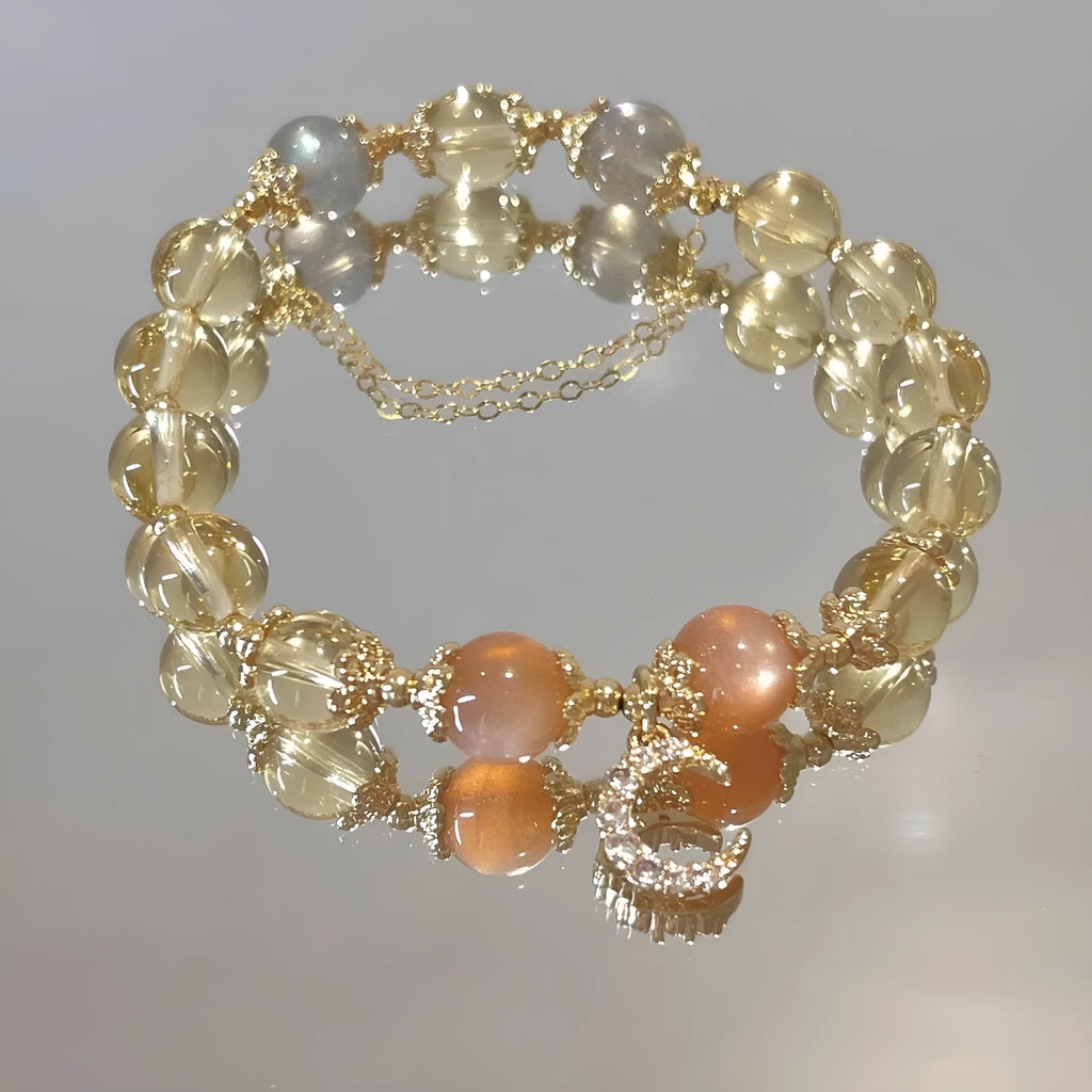 Chinese style crystal bracelet with 14K gold electroplating and citrine moonstone beads in diamond shapes