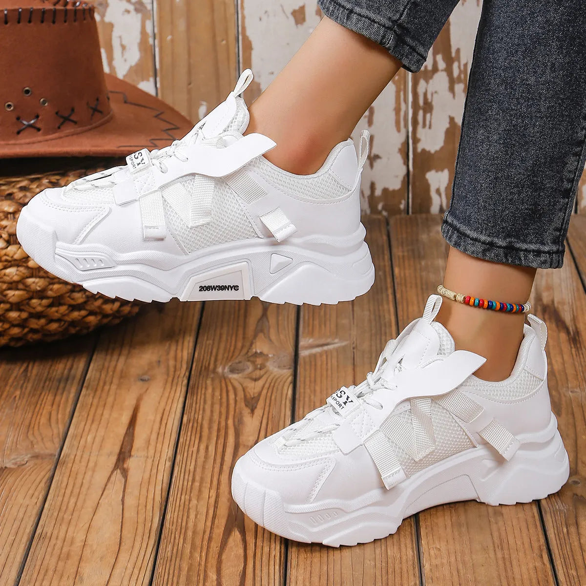 Women's purple platform mesh dad shoe with animal pattern and lace-up front on a white background.