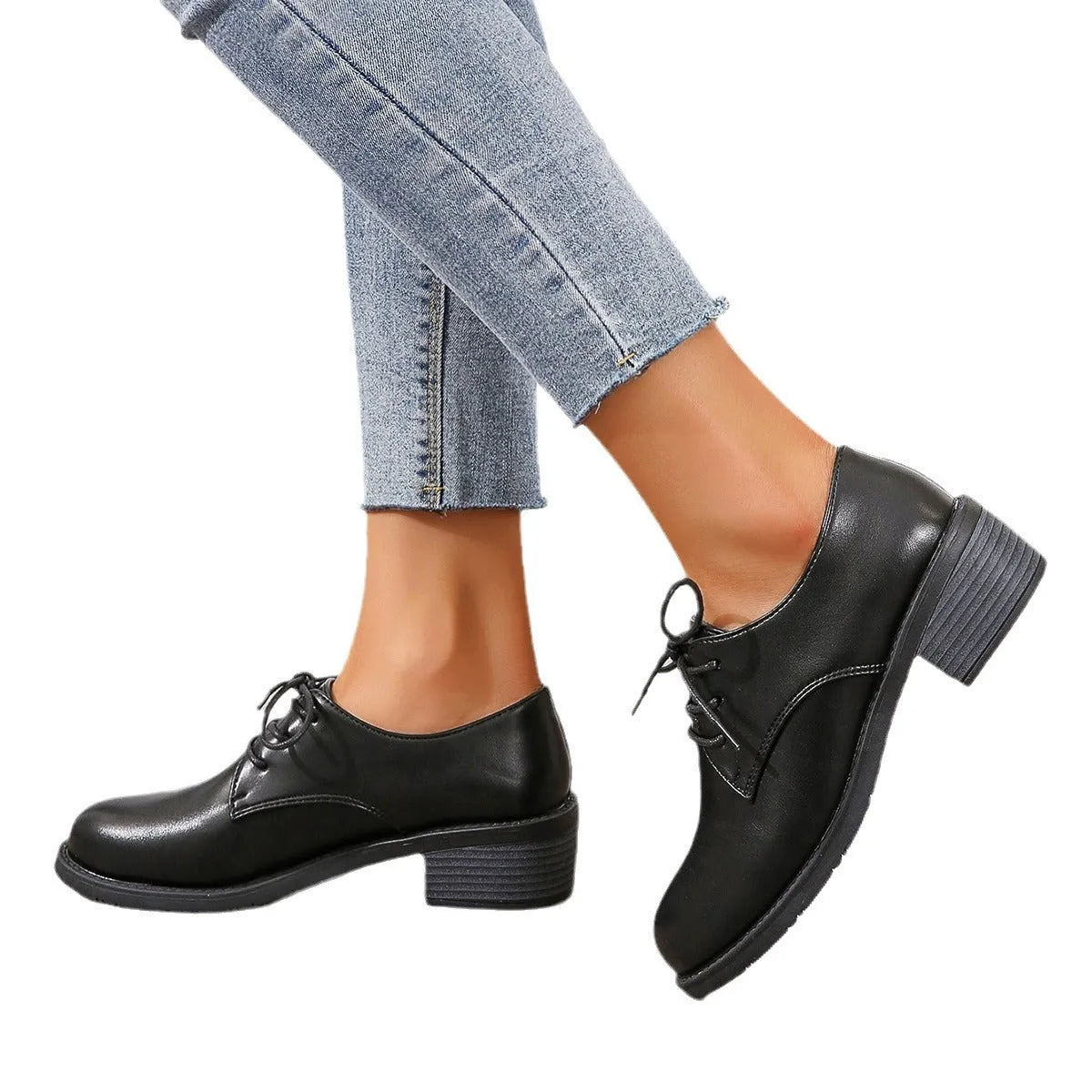Black women's low-top shoes with a chunky mid-height heel and round toe.